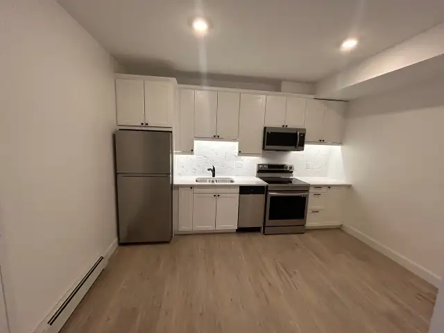 Modern 2 Bedroom Apartment - Newer Building + Parking Included