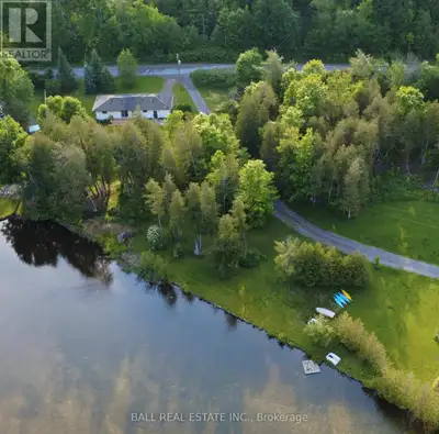 Spacious country lot with 182ft of frontage on the serene Indian River! Enjoy sunrise paddles along...