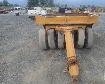 Wobbly Wheel Packer $9,900.00 WRT PT13, 13-wheel wobbly packer. Located in Haines Junction.