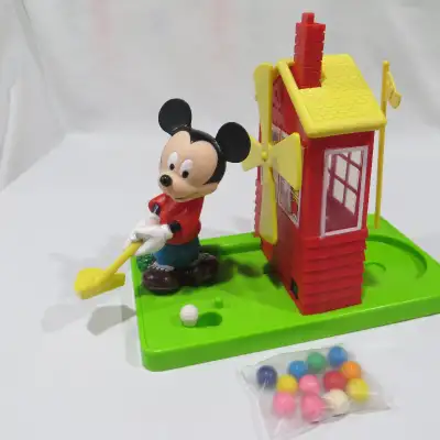 -put gumballs in club house (lift roof to drop them in) -press chimney, ball falls down, mickey swin...