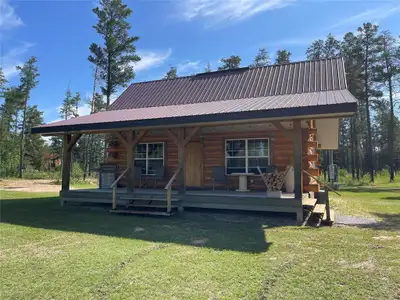 R17//Woodridge/Discover your dream rustic retreat on 3.91 private, treed acres along a paved road. T...