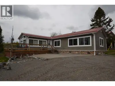 Deluxe, fully serviced cabin on beautiful Puntzi Lake. 8.9 acres with over 500 feet of lakefront. Of...