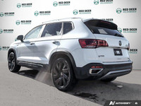 The 2024 Volkswagen Taos Highline, finished in a pristine white, comes equipped with an all-wheel-dr... (image 4)