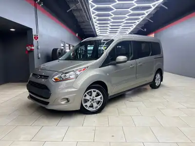 Experience the elegance and sophistication of the gold 2015 Ford Transit Connect Wagon Titanium with...