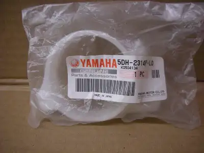 NOS OEM Yamaha left fork guard guide used on YZ 250 1996 to 2003 can be shipped at buyers cost