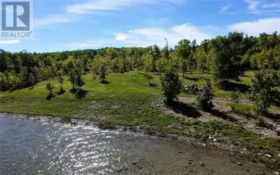 PRIME WATERFRONT BUILDING LOT - Build Your Dream Retreat on 1.28 acres with 164.83 feet shoreline! A...