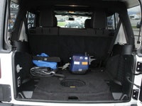 The 2018 Jeep Wrangler JK Unlimited Rubicon in stunning white with an all-wheel-drive system invites... (image 6)