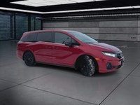 The 2025 Honda Odyssey Black Edition in a striking Red finish, equipped with a Front-Wheel Drive, of... (image 1)