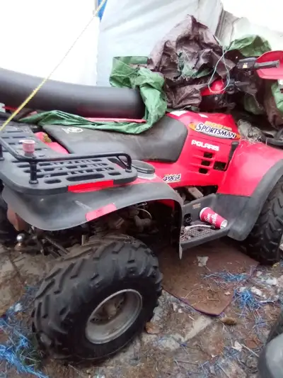 2 Polaris quads needing minor repairs up for trade. Red one is a 2002 500 4x4 with only 1300 kms and...