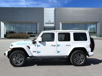 The 2024 Jeep Wrangler 4xe High Altitude 4 Door blends open-air freedom with plug-in hybrid power in... (image 8)