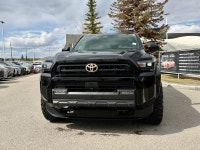 The SR5 focuses on utility and versatility, offering a standard three-row configuration and a part-t... (image 3)