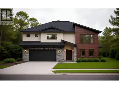 Welcome to this exceptional West Coast contemporary home in The Banks Subdivision, one of Prince Geo...