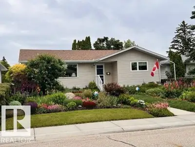 Fully Developed Bungalow! Stepping through the front entry you are greeted by hickory hardwood and l...
