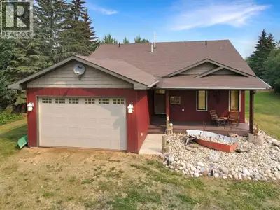 Welcome to the Fish Camp, a charming lakefront cottage nestled on 1.17 acres in Joussard, Alberta, o...