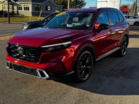 Welcome to Cumberland Honda 2026 Honda CR-V Hybrid Touring Radiant Red Metallic AWD CVT 2.0L 16V DOH... (image 4)