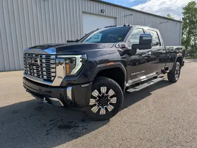 The 2025 GMC Sierra 3500HD Denali 4WD Crew Cab Long Box in a striking gray finish is an impressive f...