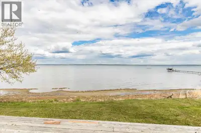 LAKEFRONT lot at Grandview! The lot is partially fenced with a gate at the back and storage shed. Ca...