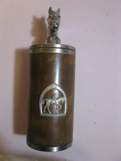 Vintage pop-up horse themed cigarette dispenser. Leather wrapped, holds 18 cigarettes. Measures 7" h...