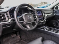 The 2024 Volvo S60 B5 AWD Ultimate Dark Theme stands out with its elegant black finish and all-wheel... (image 8)