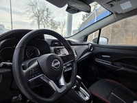 This 2023 Nissan Versa SR comes equipped with *1.6L DOHC 16-valve 4-cylinder engine*, *Xtronic CVT*,... (image 9)