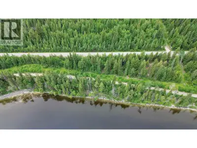Semi-waterfront 1.18 acres with lake access across the road and a spectacular view down Canim Lake....