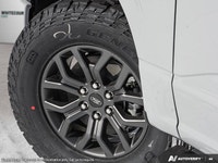 Introducing the 2026 Ford F-150 Tremor, dressed in a stunning white exterior and equipped with a rob... (image 8)