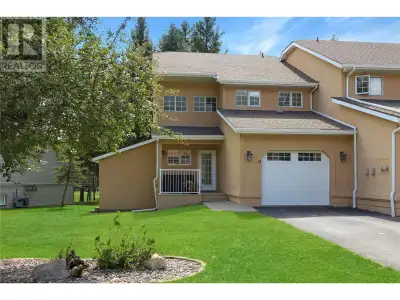 Own this spacious end-unit townhome at “The Springs on Twelfth” in Radium, BC. With three bedrooms a...
