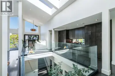 Beautiful and contemporary, this one-of-a-kind executive home in North Nanaimo—designed by Chow Low...