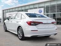 * Dual-zone automatic climate control * Heated, leather-wrapped steering wheel * Heated front seats... (image 2)