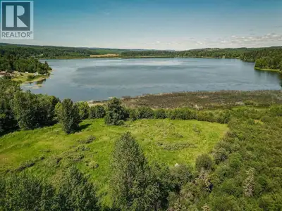 Welcome to your future lakeside retreat! This rare 0.86-acre waterfront property on beautiful Bouchi...