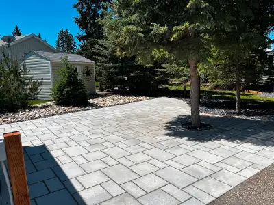 Finished lot at coyote creek, exposed aggregate concrete pad,, interlocking brick, Mennonite build s...