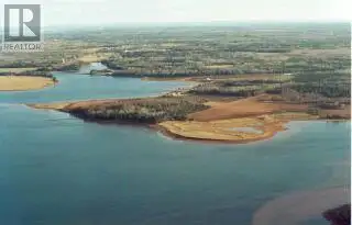 This 2.45 acre lot with a panoramic view of water from all directions sitting on a knoll sloping tow...