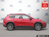Odometer is 22659 kilometers below market average! Barcelona Red Metallic 2024 Toyota Corolla Cross... (image 5)