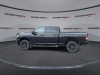 Meet the 2023 RAM 2500 Big Horn 4x4 Crew Cab 6'4 Box with the Night Edition package, offered by Hald... (image 4)