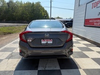 A modern compact sedan with upgraded convenience features, efficient performance, and a comfortable... (image 4)