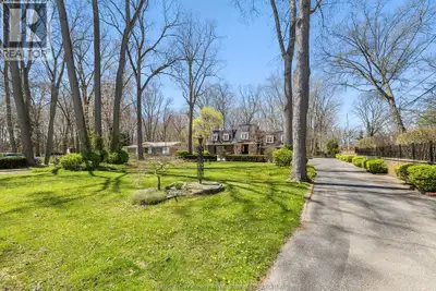 EXECUTIVE ESTATE ON SECLUDED STREET STEPS FROM ESSEX GOLF & COUNTRY CLUB & U.S.THIS HOME FEATURES CL...