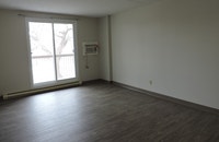 This one-bedroom apartment has a spacious living room/dining room,a full bathroom, and kitchen with... (image 6)