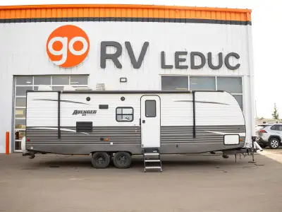 A practical family RV with a comfortable interior, flexible sleeping arrangements, and convenient ca...