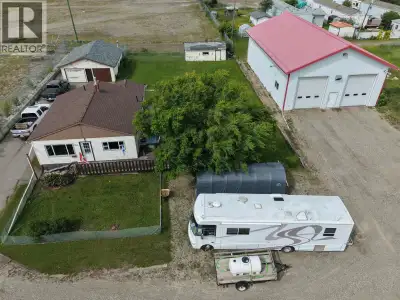 40x64 newer shop with alley access, 3 bedroom older house with detached garage 24x30. Excellent pack...