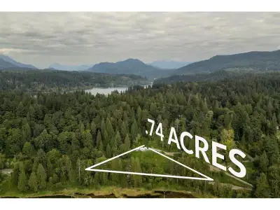 Perched high above Silvermere Lake with sweeping valley vistas, this .74-acre private parcel is the...