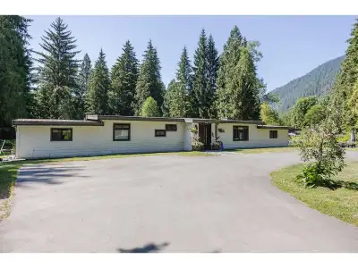 Live immersed in nature on 4.74 private, treed acres with a 3-bed (Dual Primary), 3-bath, 2,229 sq f...