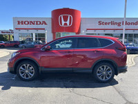 This 2021 Honda CR-V Sport, boasting a vibrant Radiant Red Metallic exterior and a sleek black inter... (image 4)