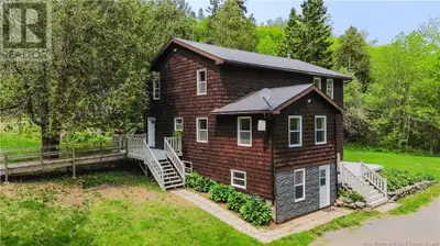 Welcome to 6390 Route 102, Oak Point! Set on 1.8 acres of gently rolling land directly across from t...