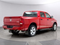 Introducing the Ram 1500 Classic Express 4x4 Crew Cab, a striking red truck that blends power and ca... (image 4)