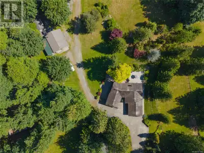 From the moment you turn into the driveway and approach this stunning custom level-entry daylight ba...
