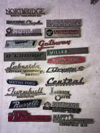 Vintage dealership keychains and emblems
