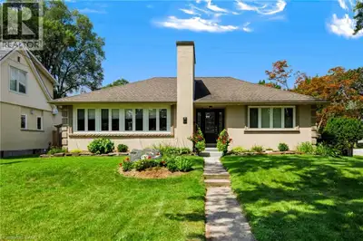 Magnificent bungalow with outstanding curb appeal that blends classic charm and timeless décor with...