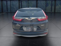 The 2018 Honda CR-V EX-L AWD in striking gray is the perfect blend of versatility and style, designe... (image 7)
