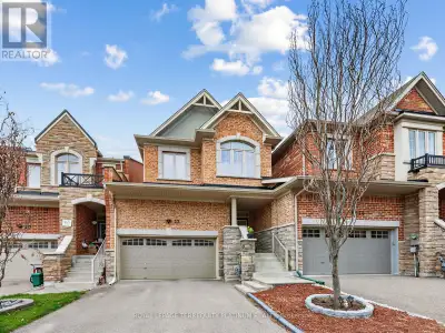 Rare Ravine Lot, Freehold Link House with a double garage, no steep staircases, and minimal attachme...