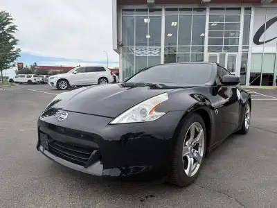 Turn heads and enjoy pure sports car performance with this stunning 2009 Nissan 370Z Touring! Powere...